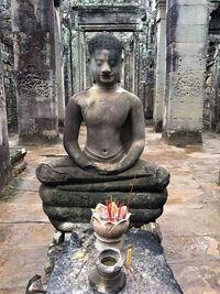 Statue of buddha against building
