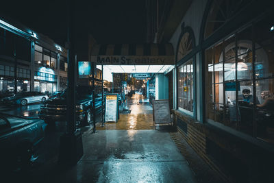 Wet corridor in city at night