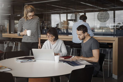 Business people working at office cafe