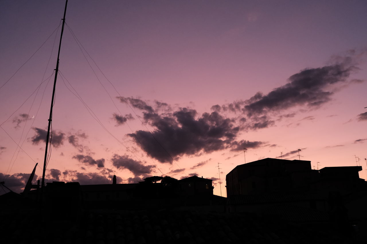 LOW ANGLE VIEW OF SILHOUETTE BUILDINGS AGAINST SKY AT SUNSET