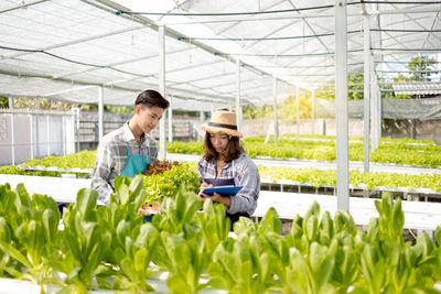 Woman working in greenhouse