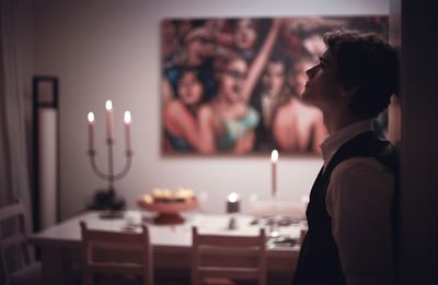 Close-up of man and woman standing on table