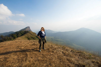 Woman standing on mountain