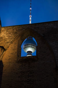 Low angle view of historical building against blue sky