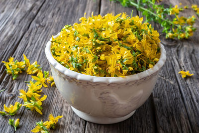 High angle view of yellow flowering plant on table