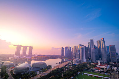 Buildings in city against clear sky