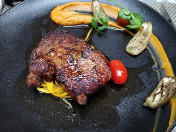 High angle view of meat on barbecue grill