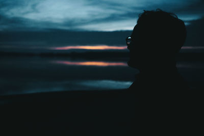 Portrait of silhouette woman standing against sky during sunset