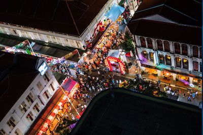 High angle view of illuminated christmas tree in building at night