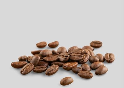Close-up of peanuts against white background