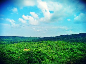 Scenic view of landscape against cloudy sky