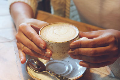 Close-up of coffee cup on table