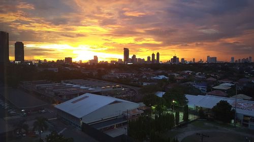 Cityscape against sky during sunset