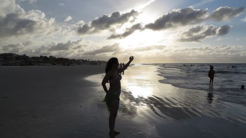 Young woman in bikini posing at beach