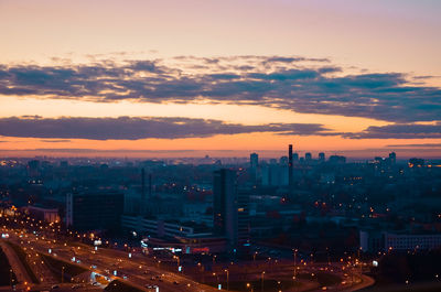 High angle view of illuminated buildings against sky during sunset