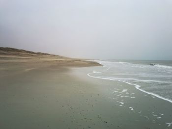 Scenic view of beach against clear sky