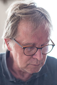 Close-up portrait of man with eyeglasses