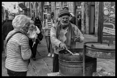 People standing on street in city during winter