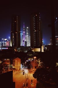 Illuminated modern buildings in city at night