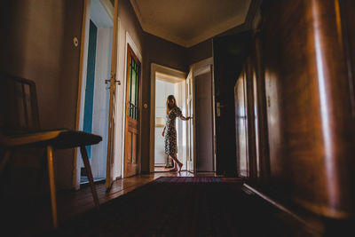 Woman standing at entrance of building