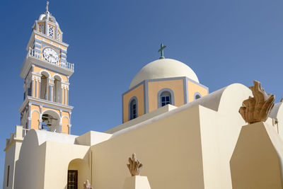 Low angle view of bell tower against sky