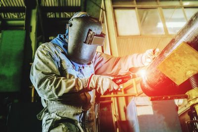 Man working on metal at workshop