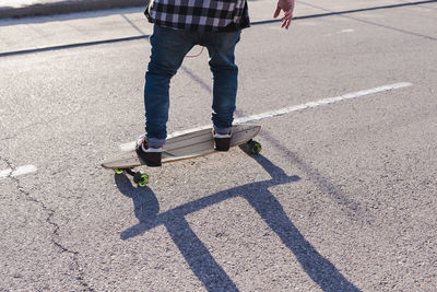 Close-up of anonymous man on longboard