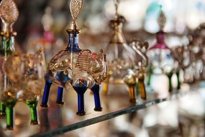 Close-up of figurine hanging on metal for sale