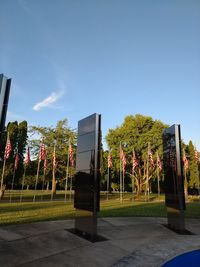 Trees and plants in park against sky