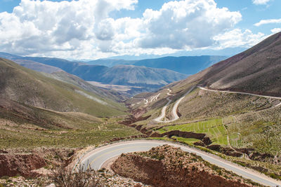 High angle view of road amidst mountains against sky