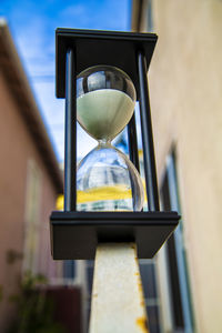 Low angle view of clock on sand