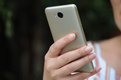 Close-up of person using mobile phone