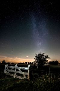 Scenic view of field against sky at night