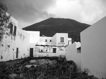 Buildings against cloudy sky