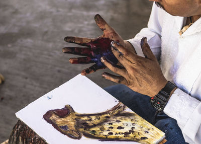 High angle view of man wearing shoes