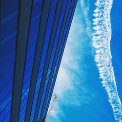 Low angle view of building against cloudy sky