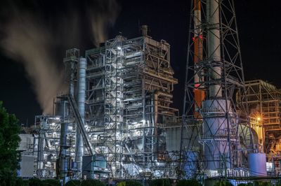 Low angle view of modern building against sky at night