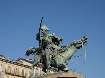 Low angle view of statue against clear sky