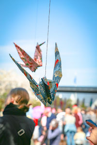 Close-up of colorful origami hanging at public park