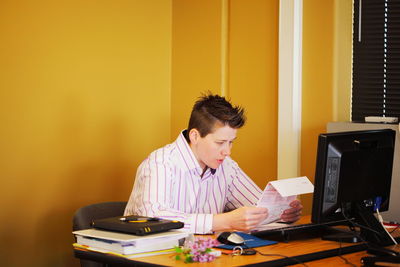 Woman looking at document