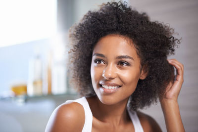 Portrait of young woman looking away