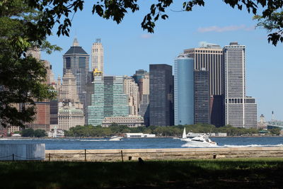 Skyscrapers in city against blue sky