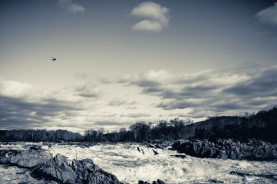 Scenic view of snowcapped landscape against sky