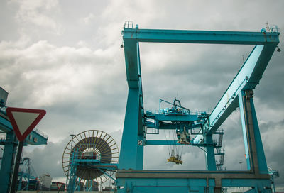 Low angle view of ferris wheel against sky