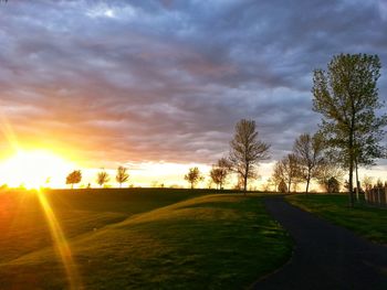 Scenic view of field against sky during sunset