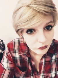 Portrait of woman with short hair at home