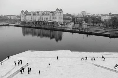 High angle view of river and buildings against clear sky