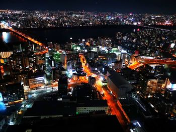 High angle view of illuminated city buildings at night