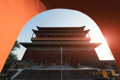 Low angle view of building against sky during sunset