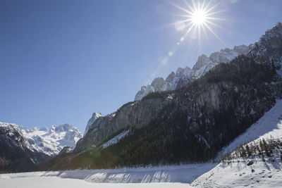 Scenic view of snow mountains against sky